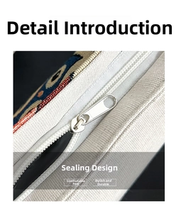 Detail showing high-quality zipper closure on ethnic woven canvas tote bag