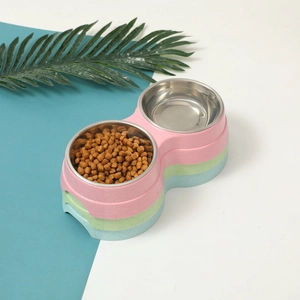Detail view of colorful stacked pet double bowls with stainless steel inserts and high base