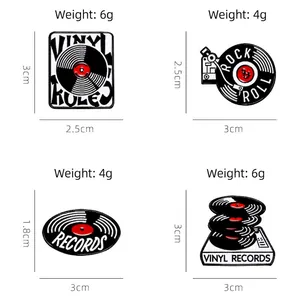 Set of four retro vinyl record enamel pins featuring rock and roll music badge designs