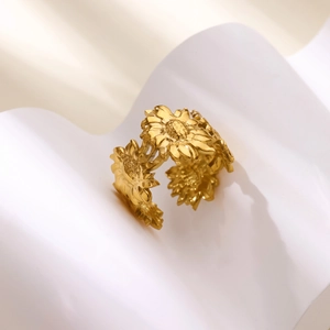 Detailed macro view of 18k gold sun flower ring with intricate petal textures