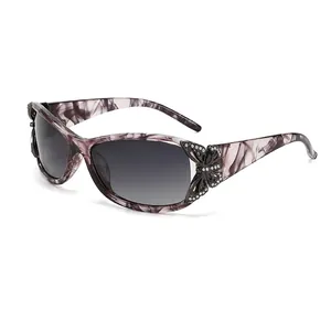 Y2K polarized sunglasses with marble pattern frame and black butterfly decoration