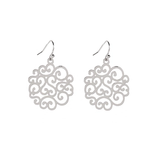 Macro shot of silver hollow-out vintage baroque earrings with intricate metal filigree