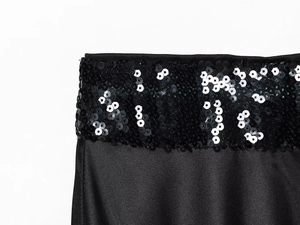 Detail of black sequined stitching and satin fabric on a fashionable tube top