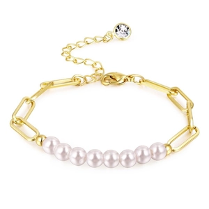 Detail of gold link bracelet featuring nine round pearls and a sparkling crystal charm