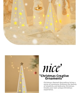 Detail of ceramic Christmas tree and angel with glowing LED light and star cutouts