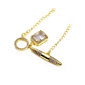 Detailed macro of gold-plated brass OT toggle clasp set with cubic zirconia stones