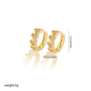Detail view of gold hollow heart hoop earrings with zircon pavé and 1.5cm dimensions