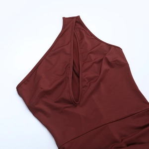 Detail shot of hollow-out neckline design on dark brown slim fit athletic jumpsuit
