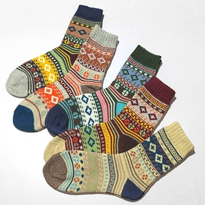 Five pairs of men's vintage ethnic style wool blend socks with geometric knit patterns