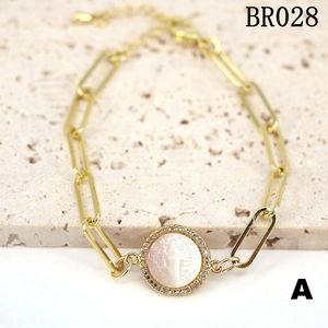 Gold paperclip chain bracelet with Virgin Mary mother of pearl medal and crystals