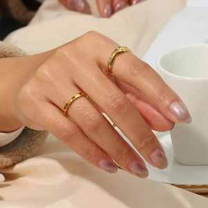 Irregular 18K gold plated stainless steel star and zircon ring set on a model hand