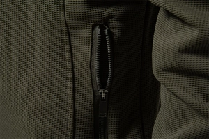 Macro shot of olive green waffle fabric texture and premium black metal zipper detail