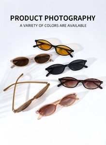 Flat lay display of retro oval sunglasses in diverse colors with botanical shadow effects
