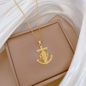 Luxurious gold titanium steel anchor necklace with sparkling crystals and portrait detail