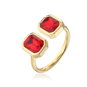 Detail of 18K gold plated open ring featuring rectangle red cubic zirconia stones