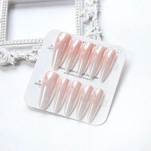 Handmade almond press-on nails with pearl finish on size-labeled display card