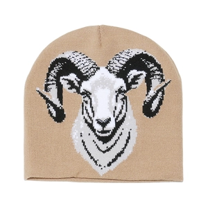 Detailed close-up of knitted ram head pattern on khaki winter beanie for casual style