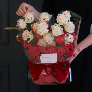 Red Christmas flower wrapping paper set with white roses and fuzzy pom-poms accents