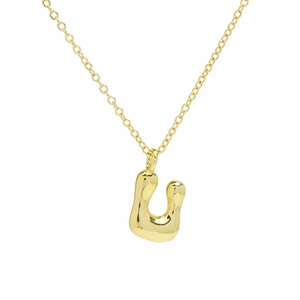 Macro shot of gold bubble U initial necklace with high-shine polished metallic finish
