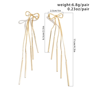 Detailed dimensions of gold bow tassel earrings with length and weight annotations