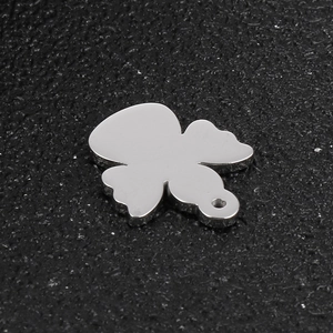 Mirror polished stainless steel angel wing pendant with geometric cutout and hanging hole