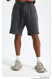 Detail of dark gray washed cotton shorts with retro texture and adjustable drawstring