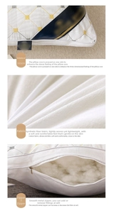 Detailed view of white hotel pillow with embroidery, durable zipper and fiber filling