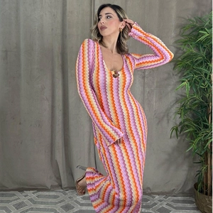 Detailed close-up of vibrant multi-color chevron knit pattern on a slim V-neck dress