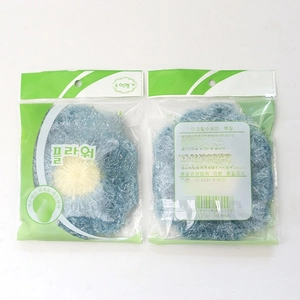 Detail view of flower-shaped acrylic dishcloths in blue and yellow packaging