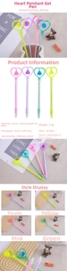Detailed view of macaron colored pens with heart pendants in purple, yellow, pink and green