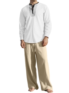 Detail of men's white linen long sleeve shirt and beige trousers with fabric texture