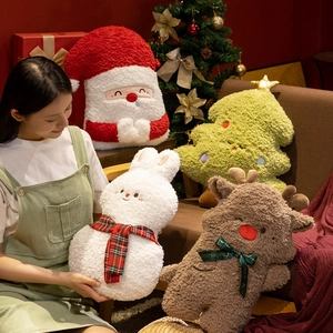 Plush Christmas throw pillows featuring Santa Claus and reindeer in soft lamb wool fabric