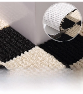 Detail of waterproof checkered kitchen mat showing non-slip backing and cut-to-fit feature