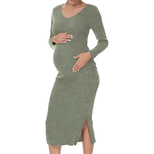 Sage green knitted maternity dress featuring long sleeves and stylish side slit detail