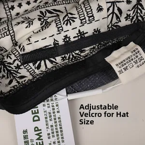 Detail view of denim beret featuring adjustable velcro strap and premium inner lining
