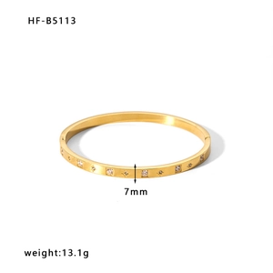 Bracciale rigido dorato da 7mm con zirconi a stella e quadrati, peso di 13,1g