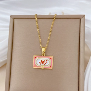 Elegant gold titanium necklace with a pink and white enamel heart rectangle pendant