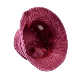 Detail view of cotton bucket hat interior showing white wash label and star embroidery