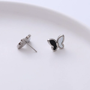 Minimalist titanium steel butterfly stud earrings with black and white shell finish