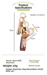 Macro detail of acrylic bubble tea bear keychain with liquid sand and a folding nail clipper