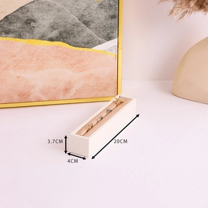 Detail view of cream-white PU leather jewelry display stand showing ring slot dimensions