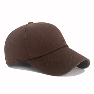 Detailed side view of dark brown cotton twill baseball cap with reinforced stitched brim