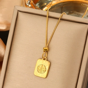 Detailed view of a gold-plated necklace with a rectangular Fu character pendant and chain