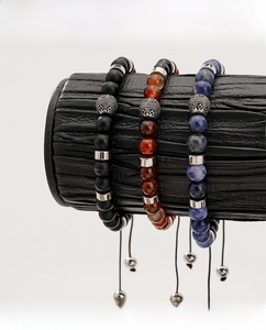 Detailed view of adjustable men's beaded bracelets with blue agate and silver metal accents