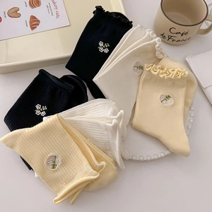 Sweet floral embroidered crew socks with scalloped edges in cream and black colors