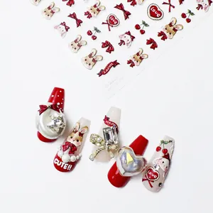 Detail of TO-2057 3D nail stickers featuring red rabbits, bows, and pearls on white base