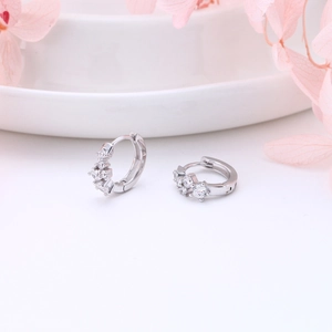 Elegant S925 sterling silver geometric hoop earrings with white zircon on a tray