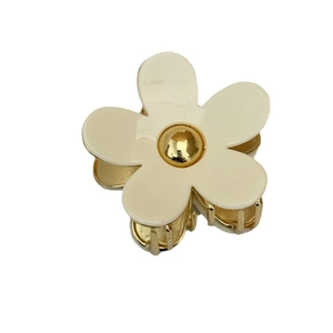 Elegant acetate flower hair claw clip with cream petals and golden metal base
