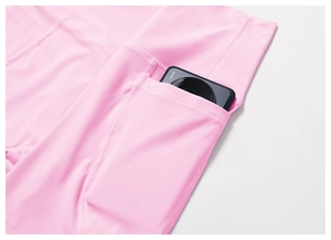 Close-up of pink quick-dry yoga leggings featuring a large functional side pocket
