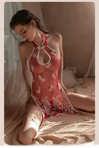 Detail of red sheer mesh cheongsam lingerie with white lace and peacock embroidery